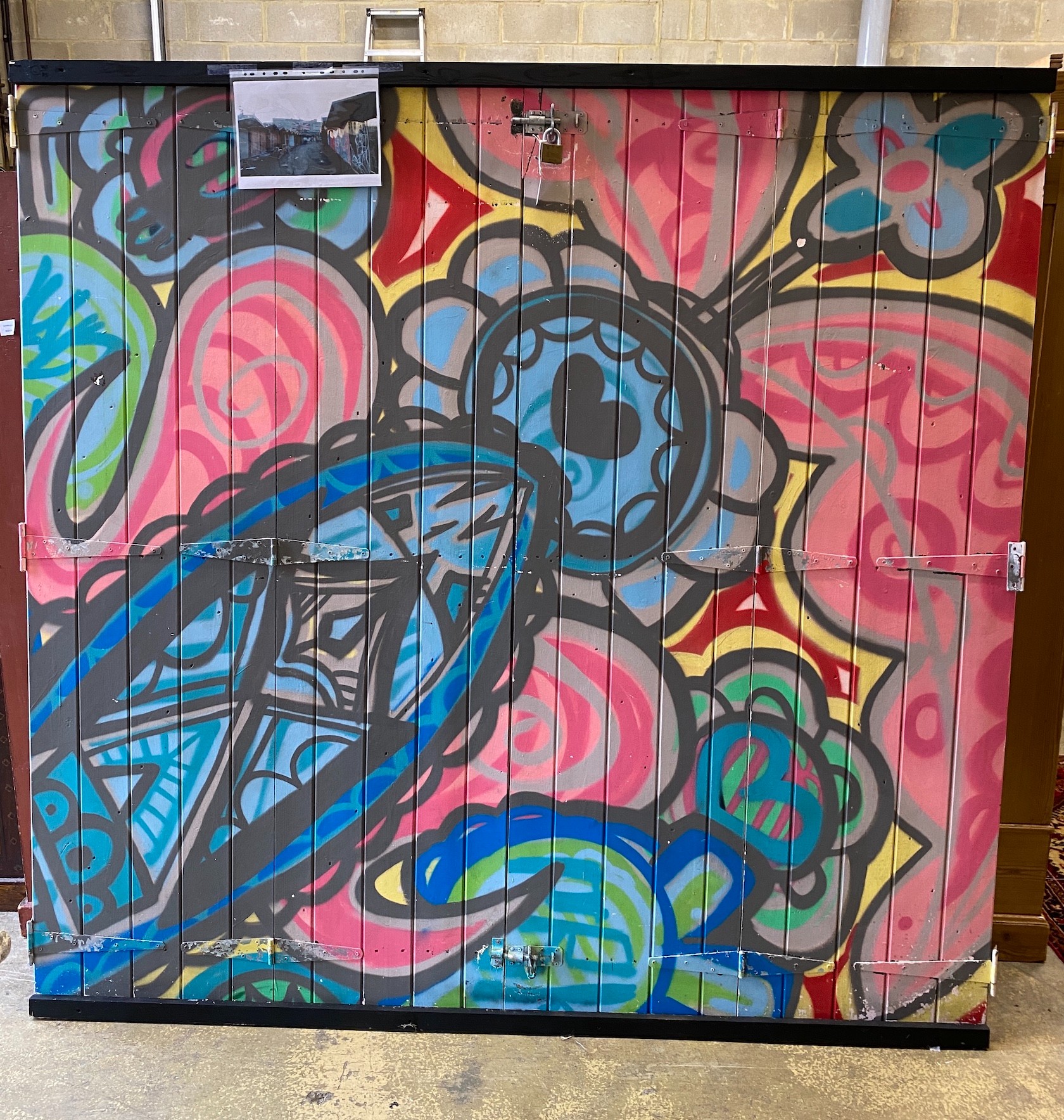 A wooden door from Camden Market with painted graffiti art width 216cm, height 207cm